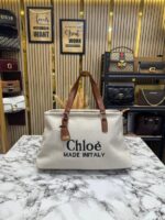 Chloé Woody Canvas Medium Logo Tote Bag – Premium Designer Shoulder Handbag with Signature Logo Straps.