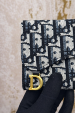 Interior layout of saddle flap wallet for men and women with multiple card slots and compartments.