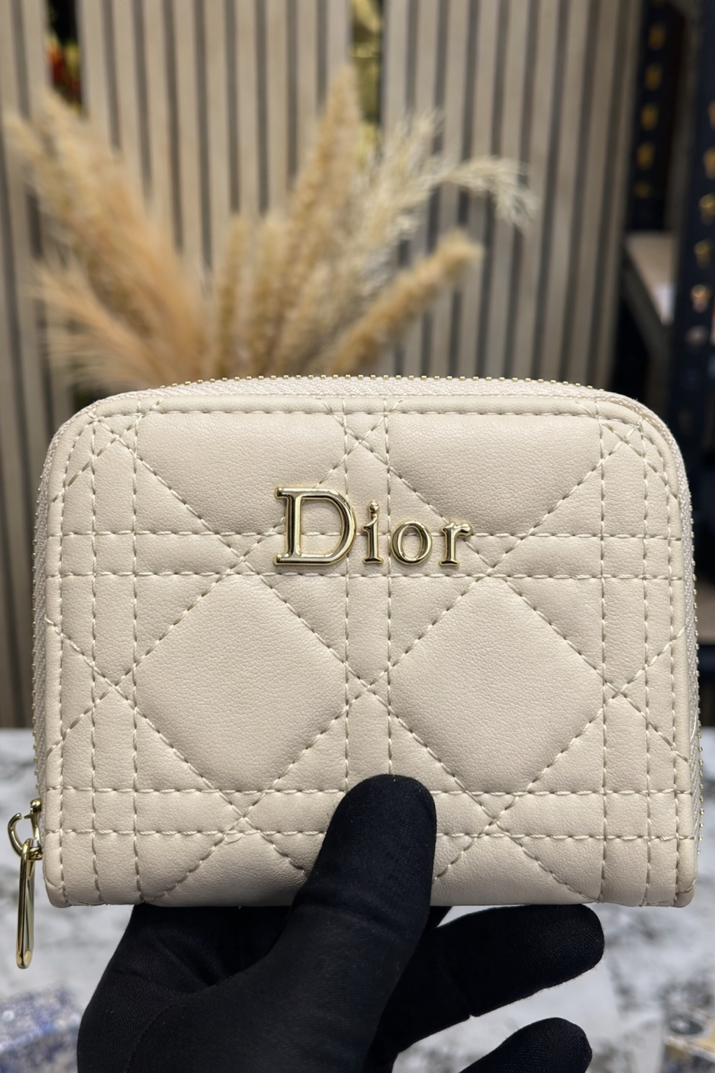 Beige Quilted Stitching Close-Up beige quilted wallet stitching detail