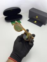 Lightweight brown sunglasses with green lenses