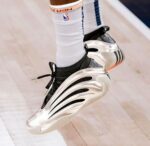 Metallic silver basketball shoes for men on court