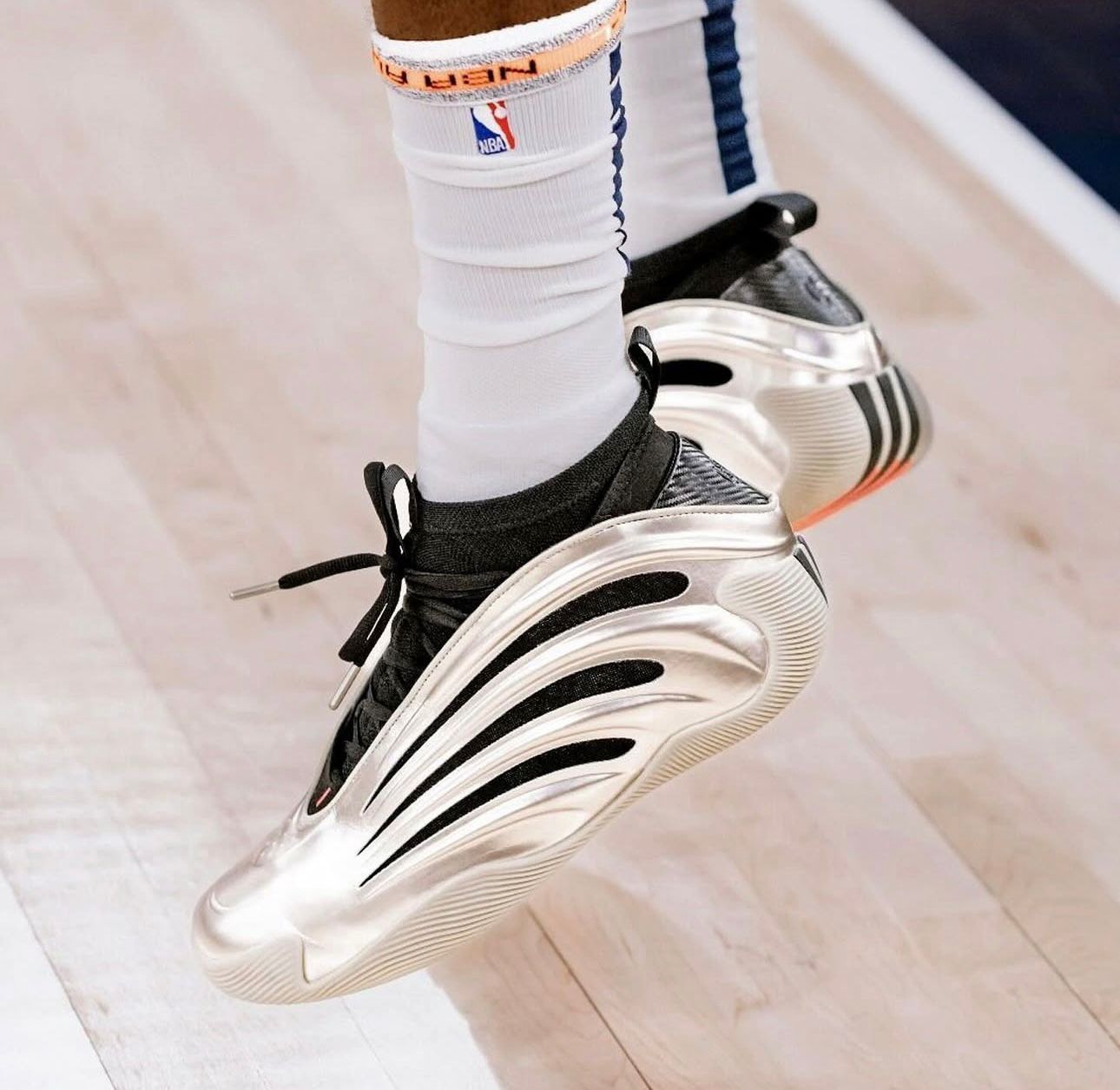 Metallic Silver Basketball Shoes Side View Metallic silver basketball shoes for men on court