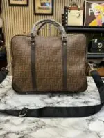 Brown designer laptop bag with dust bag for office use