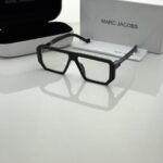 Black full-frame sunglasses with dark tinted lenses and modern design