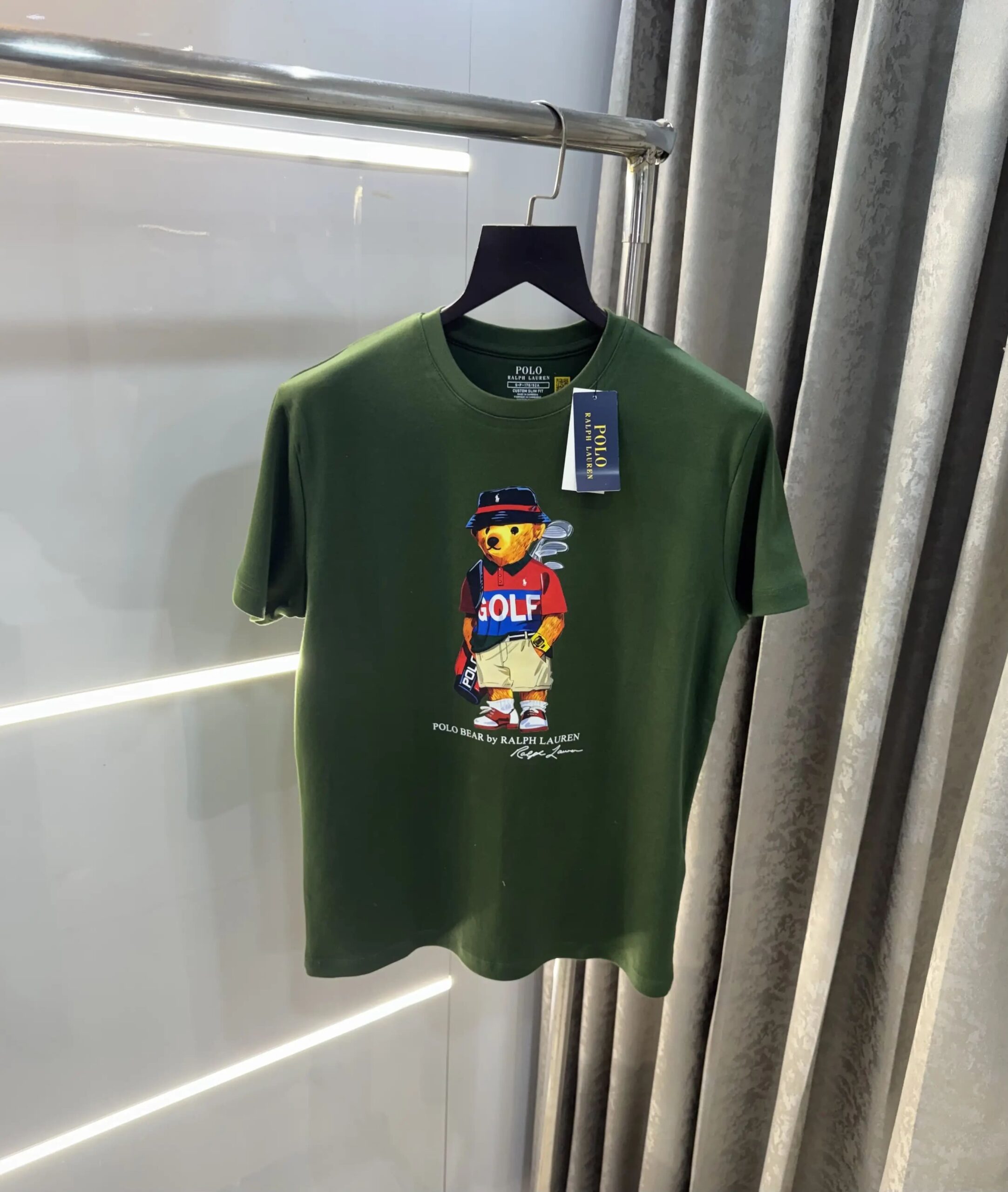 1769093741_O1yKxv Ralp.h Laure n Olive Teddy Logo Premium T-Shirt - Image 1