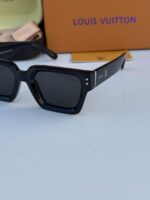 Stylish black lens sunglasses with refined frame