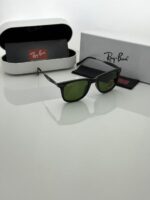Lightweight black sunglasses with green tint
