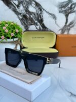 Black gradient lens eyewear with gold metal frame