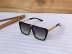 Black dark lens sunglasses for travel and city look