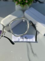 Transparent frame plano sunglasses with clear lenses