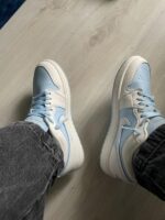 Stylish ice blue low top street sneakers close view
