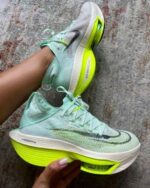 Mint green athletic shoes with responsive cushioned sole