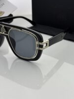 Designer style silver sunglasses close up
