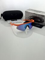 Sporty orange sunglasses with blue lenses