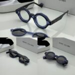 Trendy attachment style sunglasses on white.