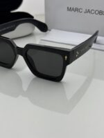 Classic black sunglasses on white background