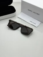 Trendy brown sunglasses on white background