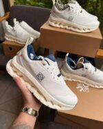 White navy training sneakers flexible mesh upper