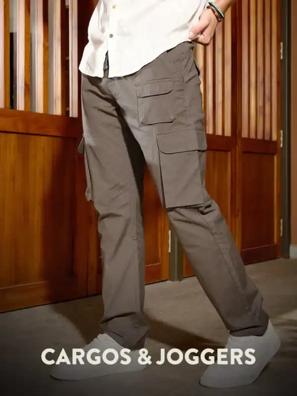 Light grey CARGOS & JOGGERS jogger-cargo pants with cargo pockets and relaxed fit, styled with a white shirt for modern men’s clothing.